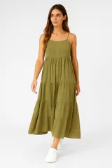 Vestido largo blanco de viscosa con breteles finos, escote recto, bordado en el busto y falda con volados.