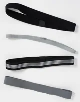 Set de cuatro vinchas elásticas deportivas de distintos anchos y colores: gris oscuro, negro con tres líneas blancas, gris claro y negro liso.