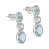 Caravanas de 2,5 cm en plata 925 con tres piedras de topacio azul.