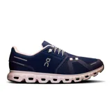 Championes de running azules con detalles en blanco y logo de la marca en el lateral.