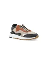 Zapatillas urbanas de cuero color beige, marrón y negro, con detalles metalizados y suela blanca.