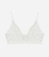 Soutien top blanco con estampado de mini flores, detalle de encaje en el escote, breteles regulables y copas desmontables.
