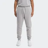 Jogger deportivo Reebok para hombre, color gris melange, confeccionado en tejido polar cepillado en el interior. Presenta cintura elástica con cordón ajustable y el logo Vector de Reebok bordado en la pierna.