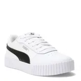 Championes Puma modelo Carina 2.0 para mujer, color blanco con franja lateral (Formstrip) negra. Presentan una plataforma gruesa con textura acanalada en la puntera y el talón, y cordones blancos.