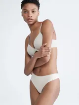Colaless de microfibra suave color blanco, con bordes cortados a láser y logo estampado en la cadera.