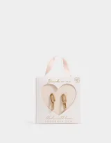 Aros colgantes cortos bañados en oro con cubic zirconia, con forma de eslabón alargado.