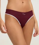 Bombacha de bikini color beige claro, confeccionada en poliamida con tecnología seamless y textura. Presenta un corte bikini clásico y un borde liso.