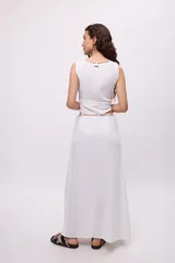 Falda larga negra de algodón con detalle de caderín con lazo.