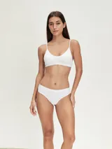 Pack de tres colaless de algodón en color gris con cintura elástica blanca.