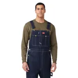 Pantalón de trabajo Dickies, tipo overol, confeccionado en denim color azul índigo.