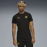 Remera de fútbol Puma color negro con detalles en amarillo. Logo de Puma bordado en el pecho y escudo del Club Atlético Peñarol estampado.