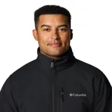 Chaqueta Columbia para hombre, modelo Ascender Soft Shell, color negro. Confeccionada en tejido softshell resistente al agua y al viento. Cuenta con protector de mentón, bolsillo en el pecho con cierre, bolsillos para manos con cierre, puños ajustables y dobladillo ajustable con ceñidor.