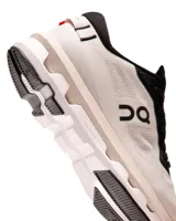 Championes de running blancos con detalles en negro, marca On Cloudzone 1.