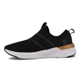 Championes Puma Softride Harli Slip On para mujer, color negro con detalles en dorado y suela blanca. Diseño slip-on con bandas elásticas cruzadas en el empeine y logo de Puma en dorado.