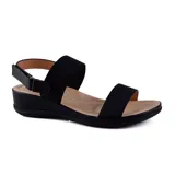 Sandalias bajas color blanco con dos tiras elásticas anchas y ajuste con velcro en el tobillo.