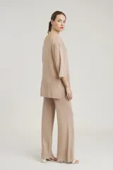 Pantalón de lurex rojo de corte palazzo.