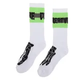 Medias blancas con puño verde neón, logo de la marca en gris y negro, y diseño de pie de esqueleto en negro.