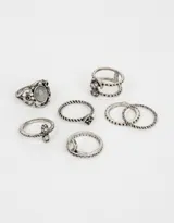 Set de 7 anillos plateados con diseño antiguo, con piedras y bajo relieve.