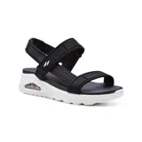 Sandalias negras con tiras de velcro ajustables, plantilla acolchada Yoga Foam y entresuela con cámara de aire Skech-Air visible.