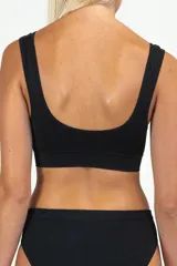 Soutien reductor color beige con breteles anchos y espalda deportiva.