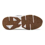 Championes Under Armour Forge 96 Reissue, color gris con detalles en negro y suela blanca con base marrón. Inspirados en el año 1996, con materiales y tecnología retro.