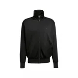 Campera deportiva Adidas Adicolor Classics Firebird color negro, con cierre frontal, cuello alto, bolsillos laterales con cierre y las tres tiras características de la marca en las mangas.