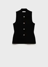 Chaleco negro sin mangas con cuello camisero, botones dorados con diseño de joya y corte entallado.