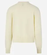 Suéter boxy color marrón, de punto leve, con cuello redondo y mangas largas con puños y bajo acanalados.