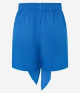 Short pollera corto color azul, confeccionado en viscolino con viscosa certificada, con cintura elástica y lazo delantero.