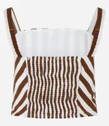 Blusa cropped sin mangas con escote cuadrado, breteles anchos con elástico, lastex en la espalda y estampa a rayas. Confeccionada en tricolina de algodón más sostenible.