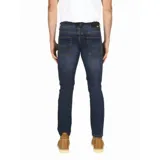 Jeans azul oscuro de corte slim, con tecnología Coolmax para confort térmico y elasticidad.