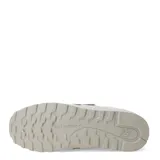 Championes urbanos New Balance modelo 373 para mujer, color gris claro/beige con detalles en blanco y cordones blancos. Presentan una combinación de gamuza y malla en el exterior.