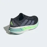 Championes de running Adidas Adistar 4, color azul oscuro con tres franjas grises en el lateral. La mediasuela es gruesa y presenta un degradado de color blanco a verde lima fluorescente, con la inscripción "REPETITOR".