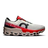 Championes de running On Cloudmonster 2, color blanco con detalles en negro, rojo y rosa.