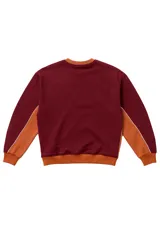 Buzo bordó de corte oversize con cuello redondo, puños y cintura acanalados en color marrón. Presenta paneles laterales con vivo blanco y logo Vernal bordado en el pecho.