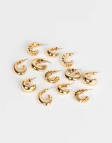 Set de seis pares de aros argollas doradas con diferentes diseños.