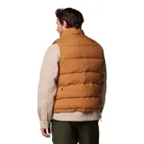 Chaleco reversible Columbia color marrón con relleno de plumón. Tiene cierre frontal con solapa, bolsillos con cremallera y dobladillo ajustable con cordón. El tejido Omni-Shield™ repele la humedad y resiste las manchas.
