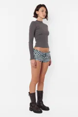 Top de morley manga larga gris, al cuerpo; largo camiseta.