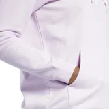 Canguro lila con capucha y cordones ajustables, logo de Reebok en blanco estampado en el frente y bolsillo tipo canguro.