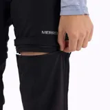 Pantalón de trekking negro desmontable, con cintura elástica, cinturón interno ajustable, bolsillos con cierre y elástico en los tobillos.