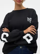 Sudadera negra de corte oversize con cuello redondo, hombros caídos y puños acanalados. Estampado frontal con la palabra "PARIS" en letras blancas y la frase "CITY OF DREAMS 1978" debajo.