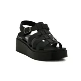 Sandalias de plataforma color negro, con tiras entrecruzadas y pulsera con hebilla.
