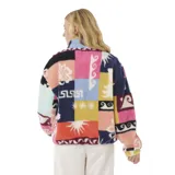 Canguro de polar fleece multicolor con cierre frontal y cuello alto. Presenta un diseño de patchwork con estampados florales y geométricos en tonos azul marino, rosa, amarillo y rojo.