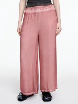 Pantalón amplio gris de viscosa teñida en frío, con efecto gastado, cintura elástica y calce relajado.