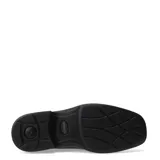 Zapato de vestir de cuero negro con cordones y suela de goma.