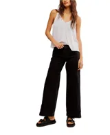 Pantalón de denim negro de corte ancho y relajado, ideal para un look cómodo.
