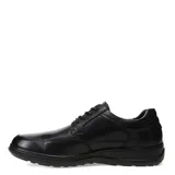 Zapato de vestir de cuero negro, con cordones y suela de goma.