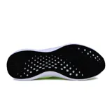 Championes deportivos Actvitta color amarillo flúor, acordonados, con suela blanca y detalles en negro.