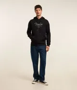 Buzo hoodie negro de algodón con felpa, con cordón ajustable, manga larga, bolsillo canguro, puños y barras ajustados y estampa lettering delantero con el logo de Fender.