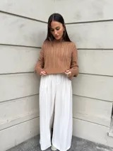 Sweater tejido de punto color rosa con diseño de ochos.